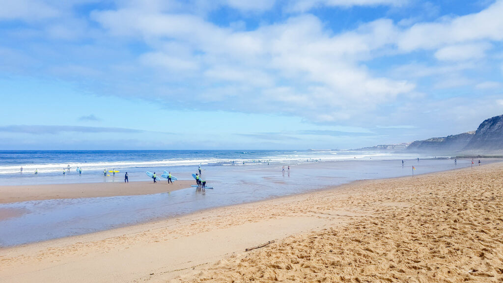 Surfers at Foz do Lizandro beach, Ericeira | Portugal 2 weeks itinerary