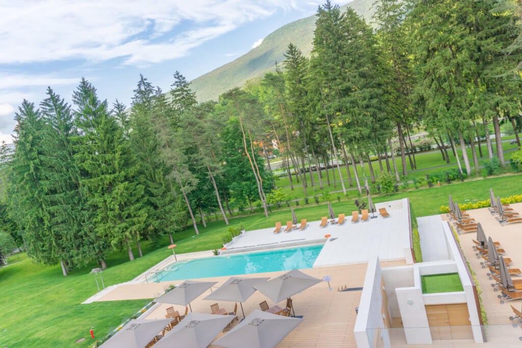 Outdoor swimming pool at Grand Hotel Terme di Comano - 1 week Trentino itinerary