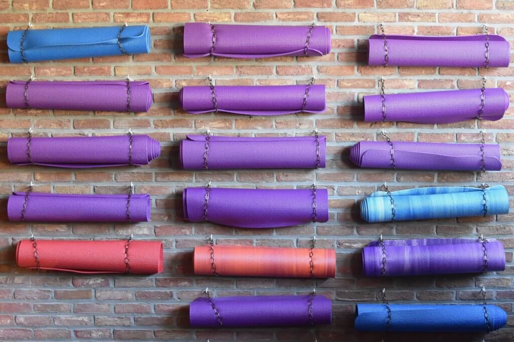 yoga mats on a wall