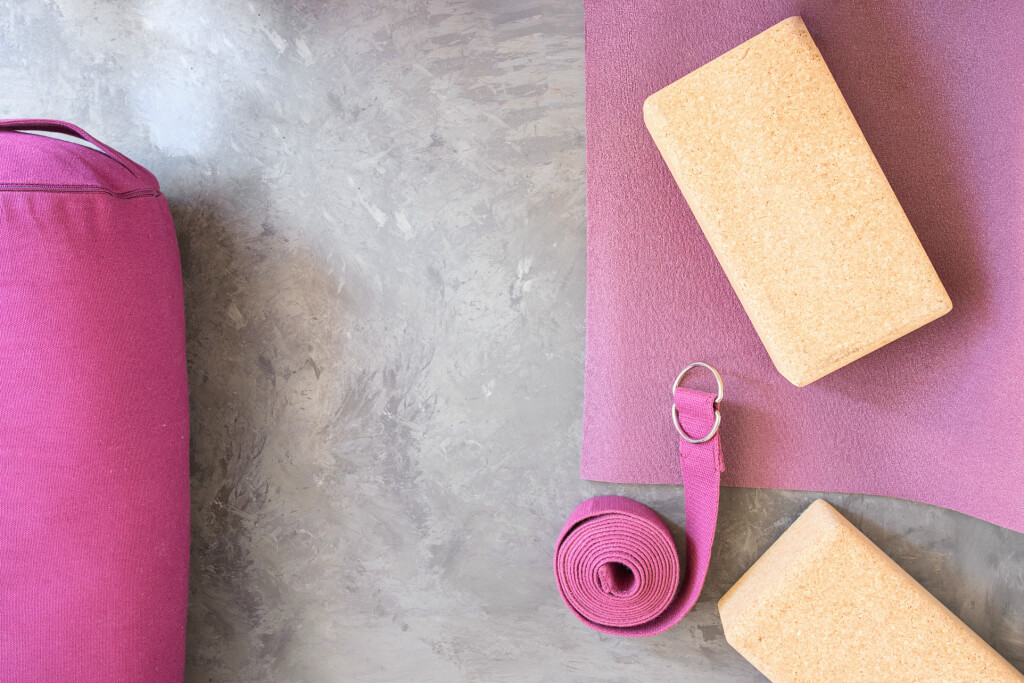 pink yoga bolster and mat